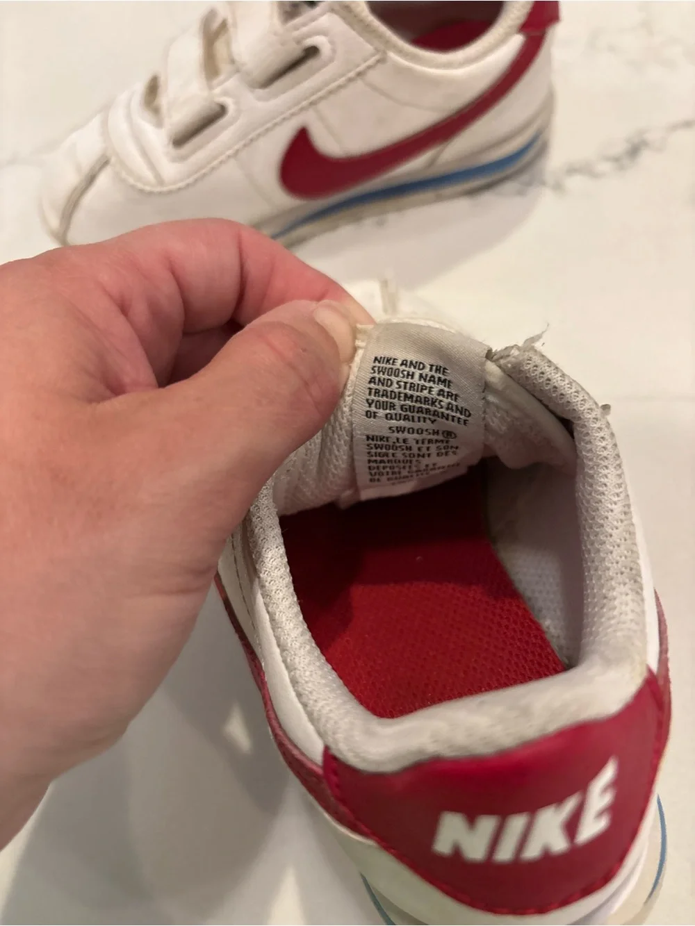 Nike Kids White Sneakers with Red Swoosh